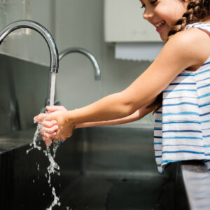 Little girl using tap water in Lakeland, FL